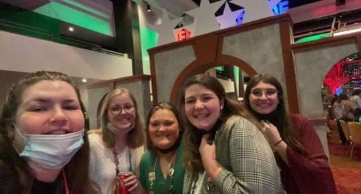 Bailey (second from right) and Johns-Devries (right) with friends at the conference